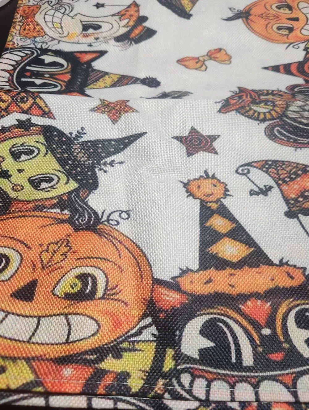 Festive Halloween table runner featuring playful pumpkin, owl and cat characters